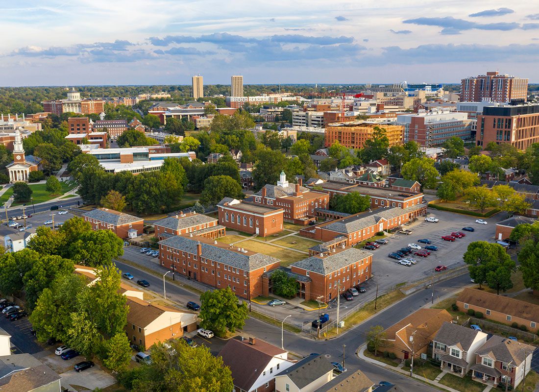 Canton, OH - Aerial View of Commercial Buildings and Homes Surrounded by Green Trees in the City of Canton Ohio on a Sunny Day